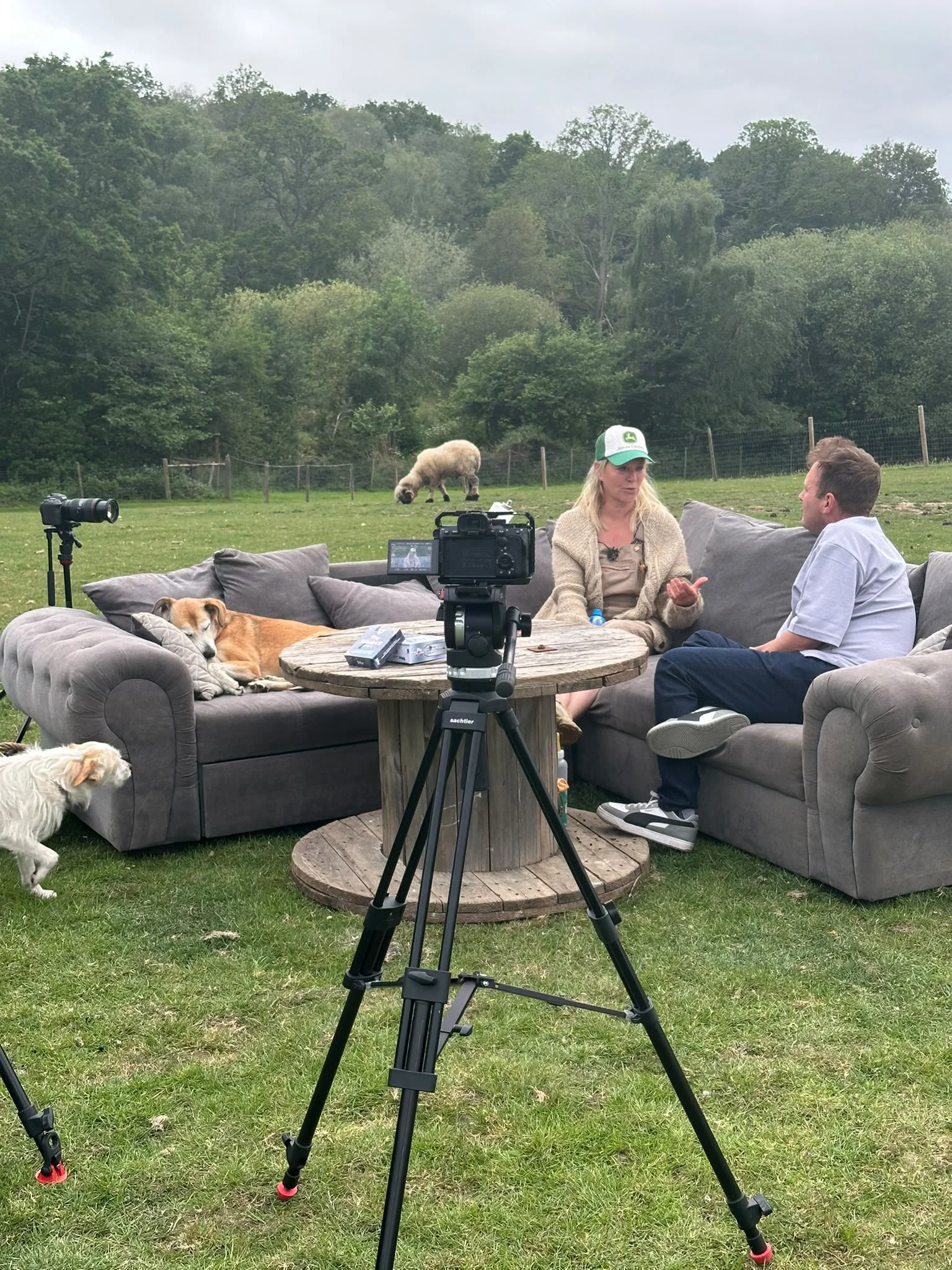 An outdoor podcast recording with cards on the table